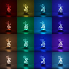 Lampa LED decorativa, Kaveny, 3D, Ursulet cu balon inima, cu telecomanda, doua moduri de alimentare USB si baterii, 20 cm inaltime, din material acril si lumina multicolora, alb