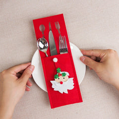 Husa decorativa pentru set tacamuri Kadeny, model Mos Craciun, material poliester, 25 x 8.5 cm, rosu