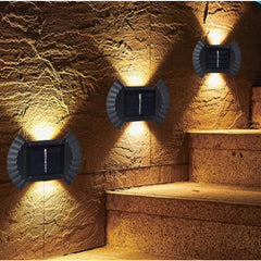 Set 4 Aplice solare LED Bidirectionale pentru perete Kaveny, in forma de funda, 8 LED-uri, material ABS si PC, lumina puternica, IP65, 10 x 7.5 cm, baterie 1.2 V, 300 mAh, autonomie 8-10 ore, alb cald