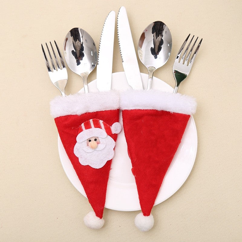Husa decorativa festiva pentru 3 tacamuri Kaveny, model caciulita cu Mos Craciun, material textil si poliester, 19 x 10 cm, rosu