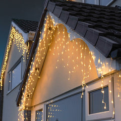 Instalatie Craciun Yoto, Tip Franjuri/Turturi, 4 m, 120 LED-uri, Prelungitor 1.5 m, 8 Jocuri de Lumini, Interconectabila, Conectare la Retea, Fir transparent, Interior/Exterior, Alb Cald