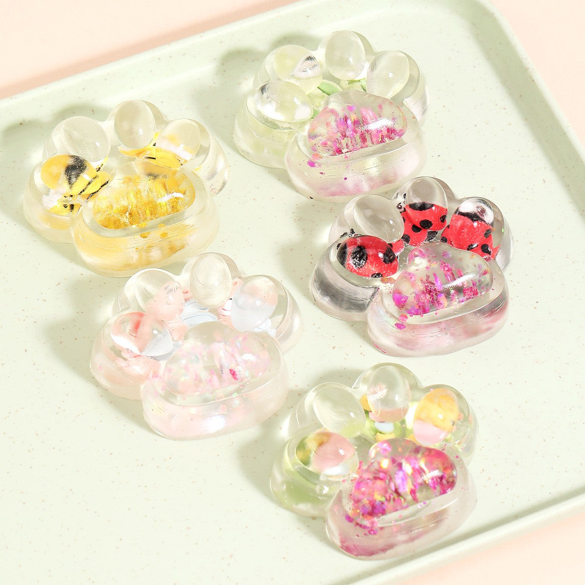 Jucarie Antistres Squishy, Kaveny, cu Revenire Lenta, Squeeze Pinch Family, Model Cat Paw, 6.5 x 7 cm, din Tpr, 4-6 Ani, Model 7 Insecte, Transparent