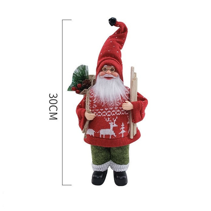 Figurina Decorativa Craciun, Kadeny, Mos Craciun cu Lemne la Brat, 30 x 17 x 10 cm, Material Plastic+Textil, Interior/Exterior, Rosu/Verde