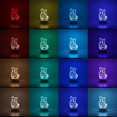 Lampa LED decorativa, Kaveny, 3D, Ursulet, cu telecomanda, doua moduri de alimentare USB si baterii, 20 cm inaltime, din material acril si lumina multicolora, alb