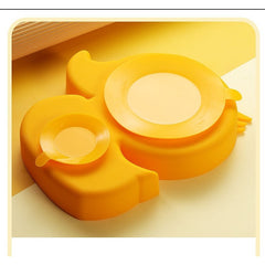 Set diversificare bebelusi Kaveny, din silicon, 20 x 17.5 cm, 1 farfurie compartimentata in forma de rata, lingurita si furculita, pai, perie pai, fara alergeni, ventuza fixare,  forma creativa,  galben